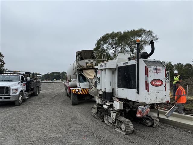Pouring along MDOT curb concrete
