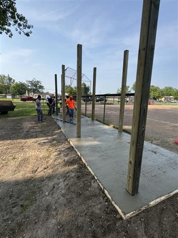 Donated baseball field concrete by Messina